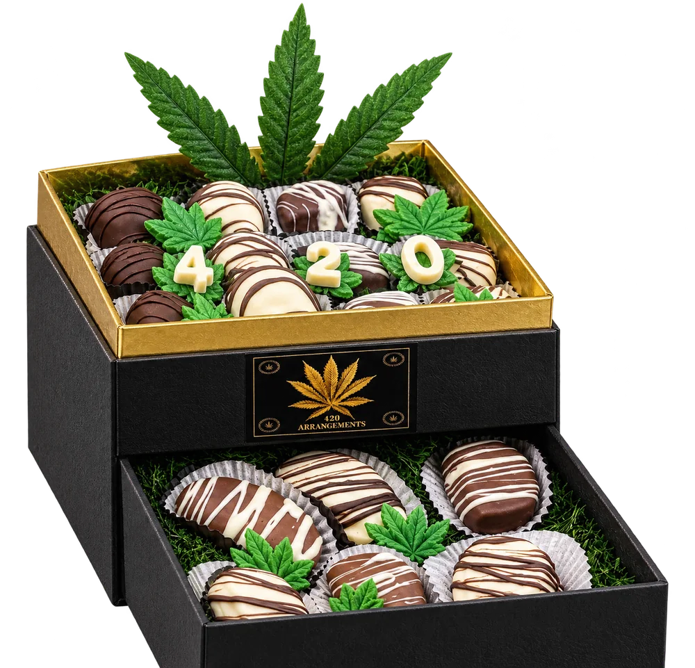 The drawer pulled out, showing the second layer of chocolates under the leaves.